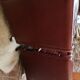 Couple de fauteuil en simili cuir rouge bordeaux, annees 70