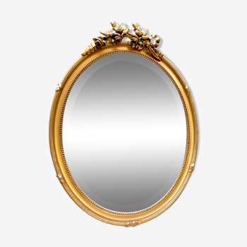 Bevelled oval mirror in vintage gilded wood 46x62cm