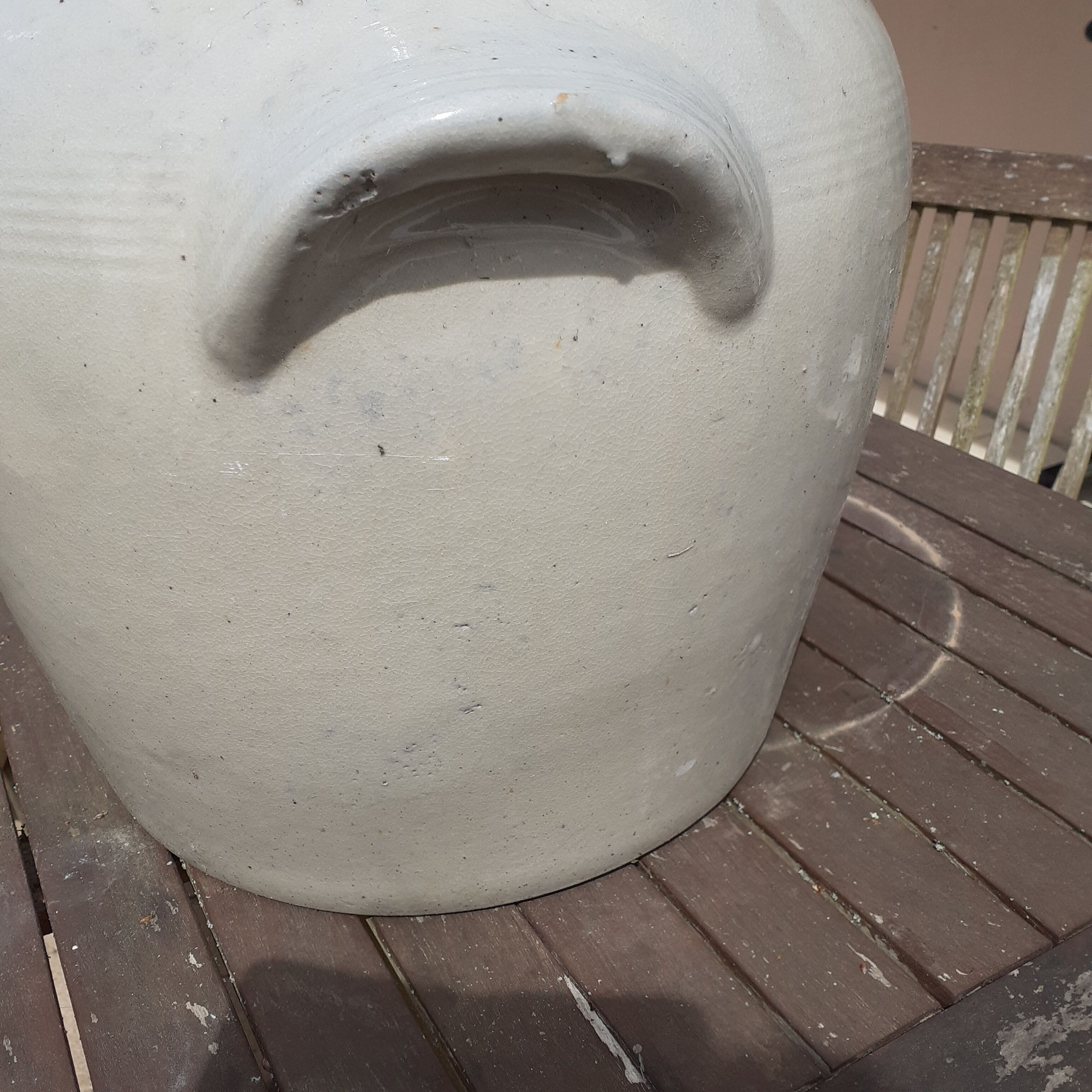 Old pot in beige sandstone.