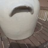 Old pot in beige sandstone.