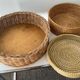 Trio of vintage wicker and woven raffia baskets