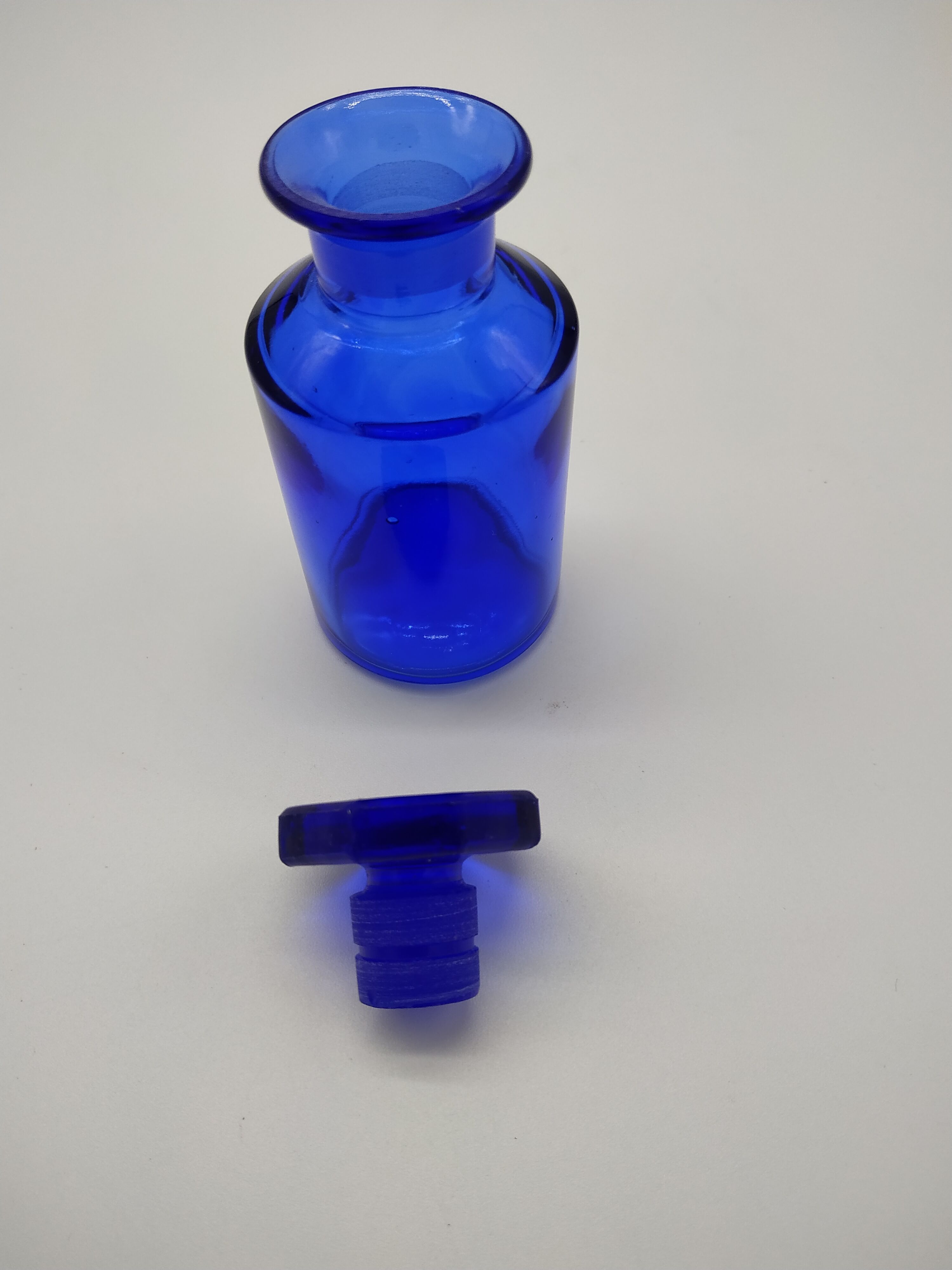 Old perfume bottle in cobalt blue glass