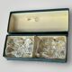 Pair of crystal salt shakers and glass spoons signed Daum Cristal