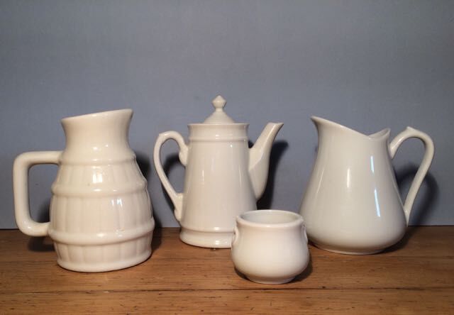 Trio of pitchers and jam jar