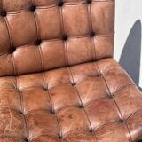 Pair of leather chairs by Robert Haussman