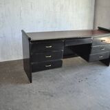 Hungarian Art Deco desk in black painted wood with a brown top and metal handles.