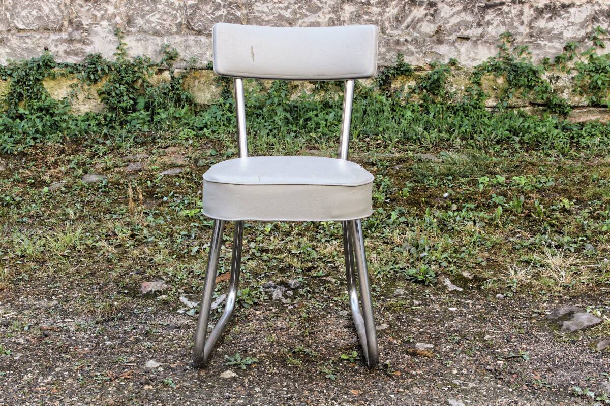 Set of 2 chairs and 1 armchair from the 70s in chrome metal and faux leather.