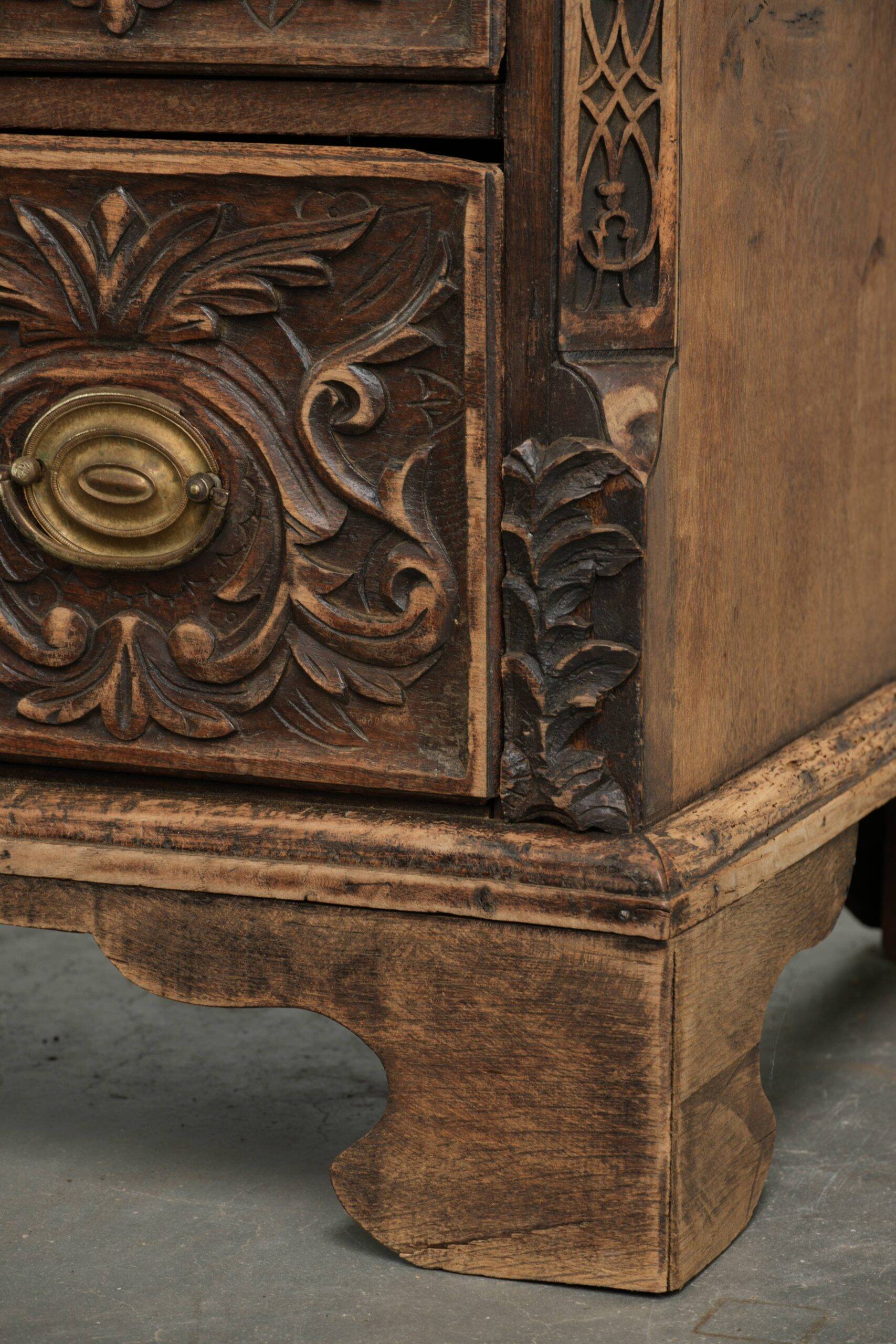 Richly carved English oak chest of drawers from the 18th century