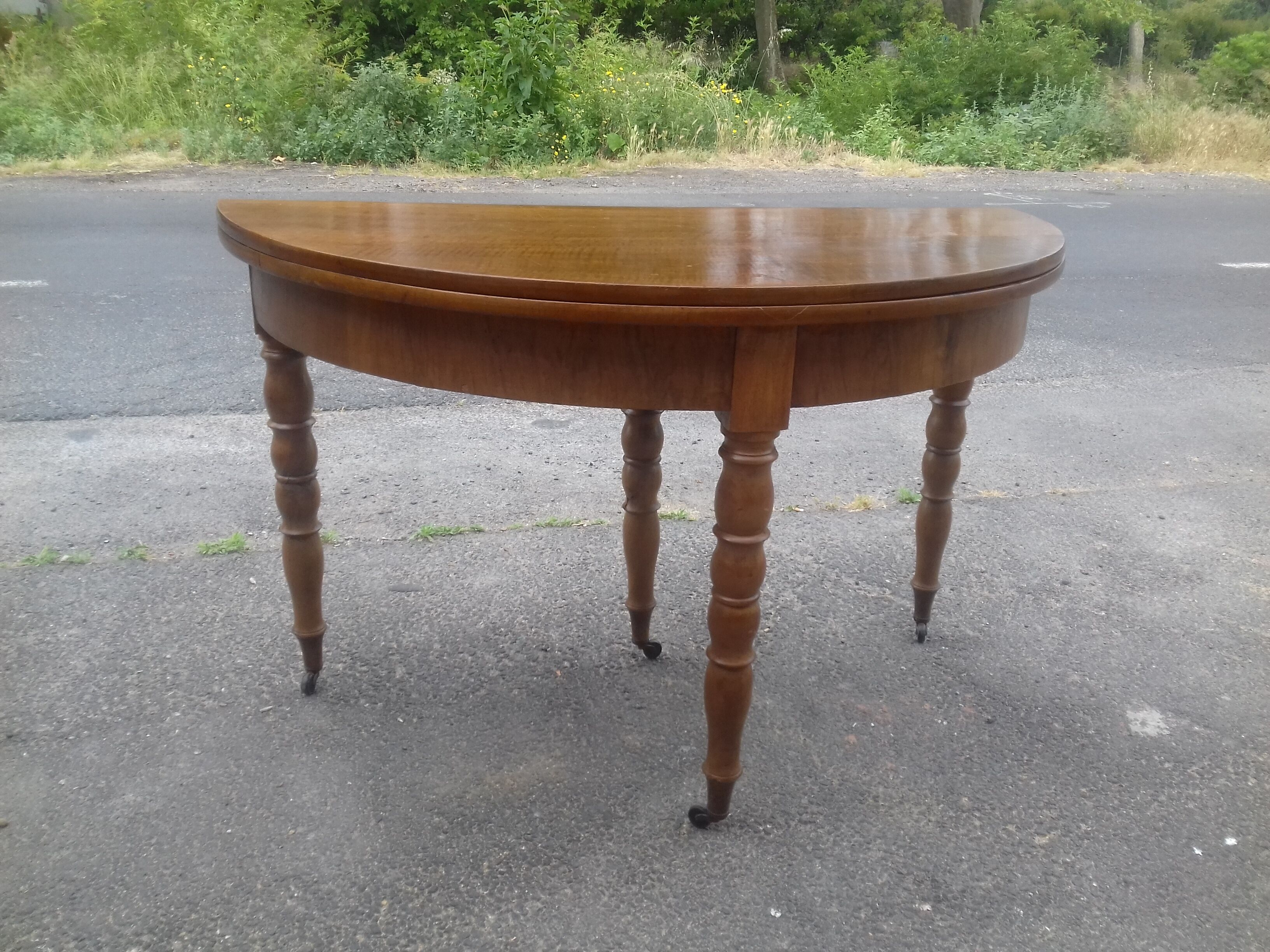 Half-moon walnut console table, circa 1840, Jacob base