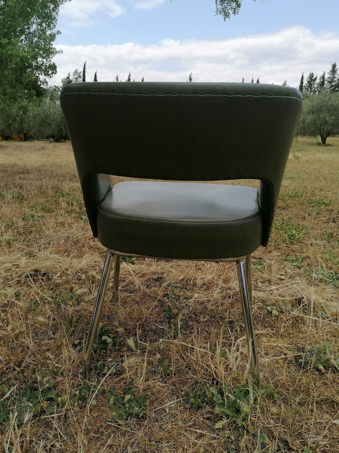 Vintage conference armchair in green skai Roset SNA