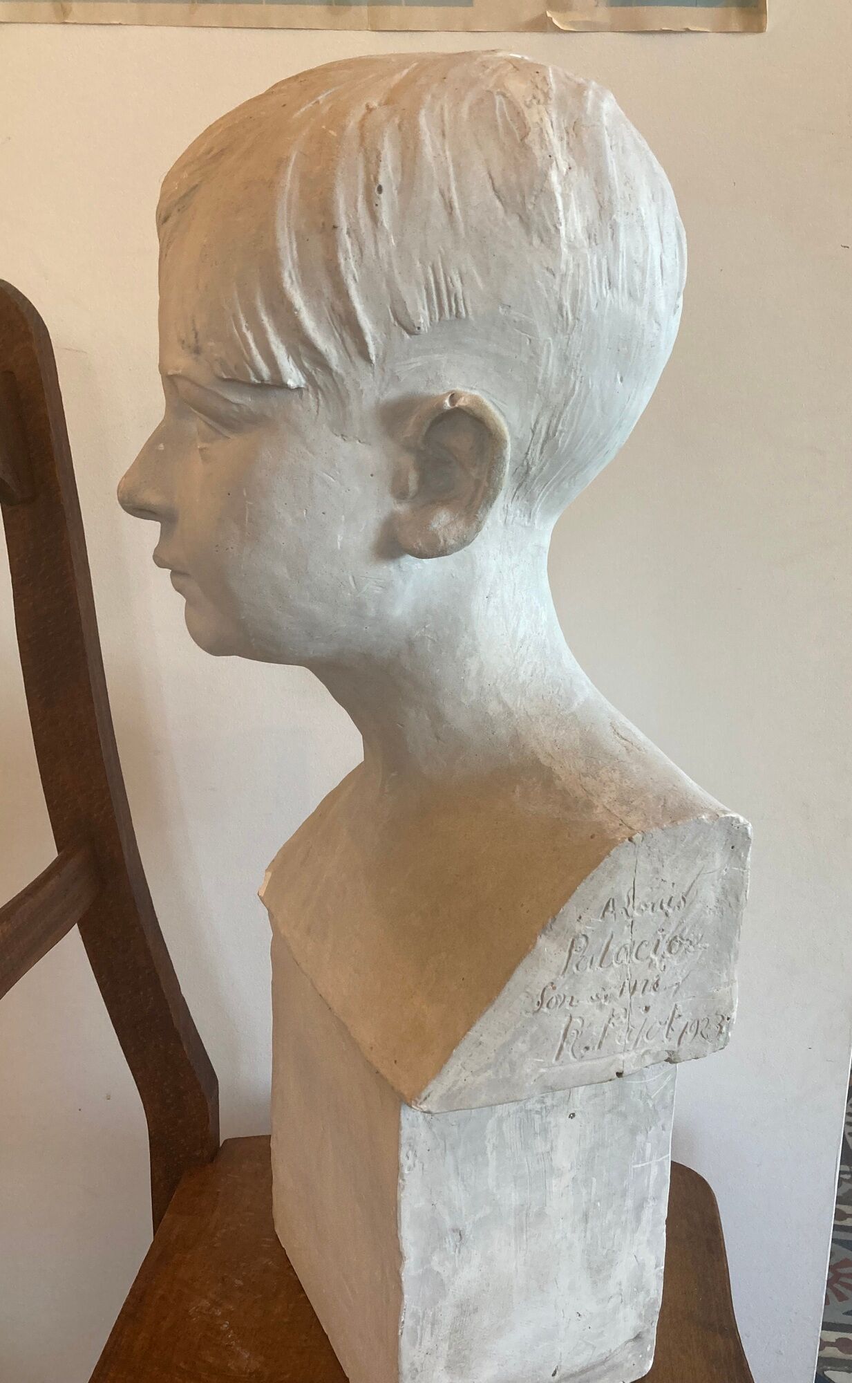 Bust portrait of a child in plaster signed René Pajot for his friend Louis Palacio