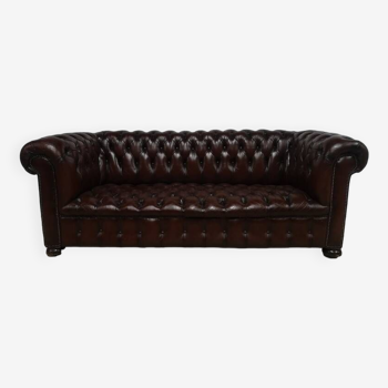 Upholstered brown leather Chesterfield sofa