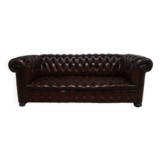 Upholstered brown leather Chesterfield sofa