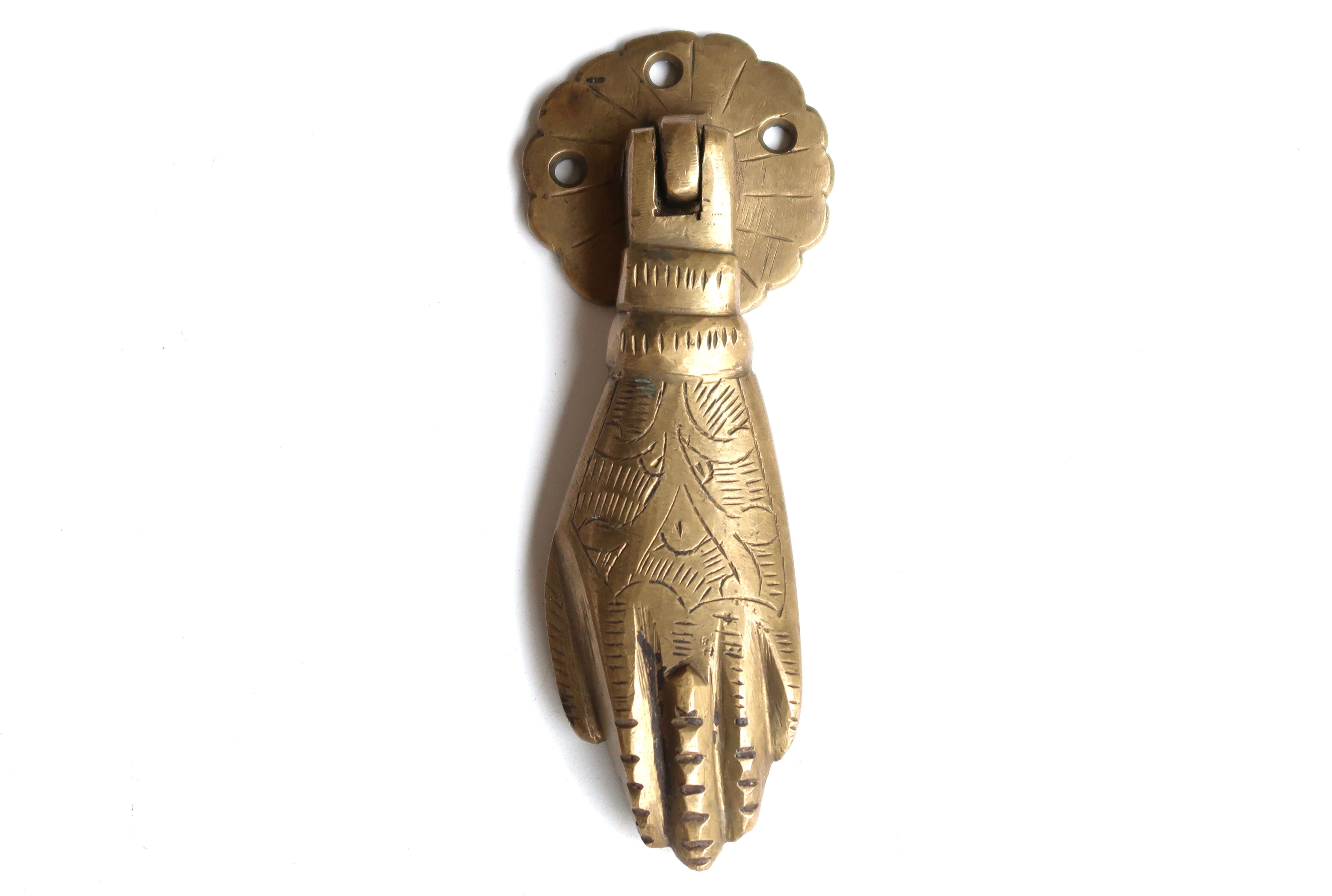 Hand-shaped brass door knocker, 70s
