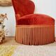 Red velvet toad armchair with fringes