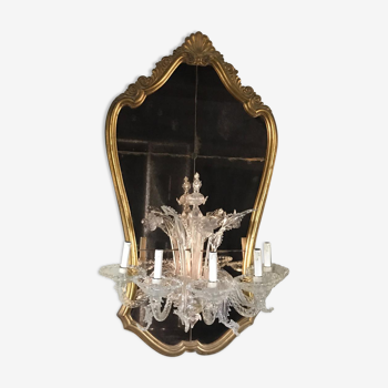 Venetian mirror topped with half a chandelier of Murano