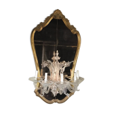 Venetian mirror topped with half a chandelier of Murano