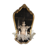 Venetian mirror topped with half a chandelier of Murano