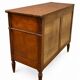 Light walnut commode in Louis XVI style with fluted motifs and three drawers.