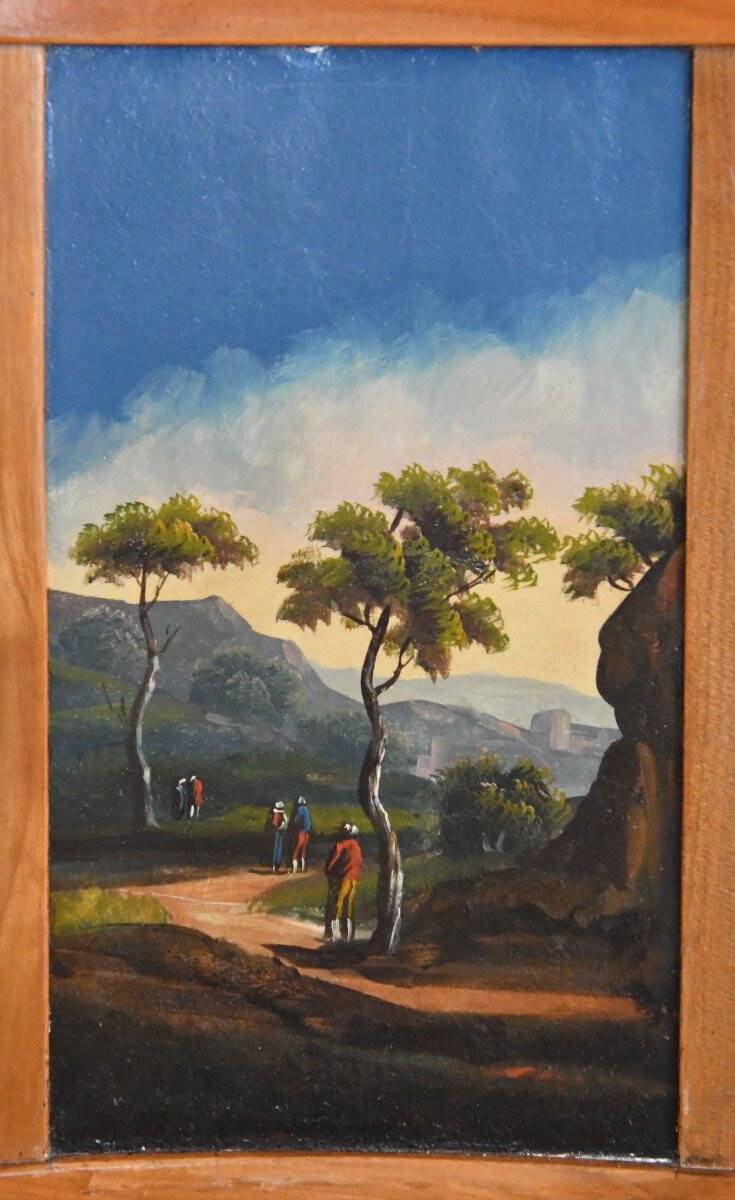 Pair of chairs with slatted backs and painted bands depicting animated landscapes.