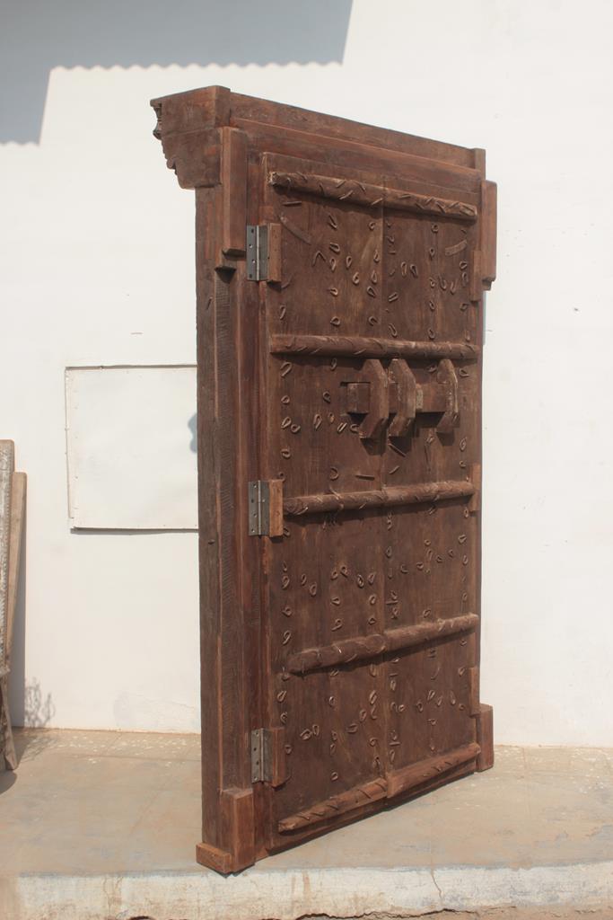 Old Indian door in old teak, piece and patina of origin