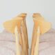 Set of 6 soft pink fabric dining chairs, Scandinavian design, natural wood.