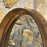 Vintage round smoked plastic mirror, circa 1970s.