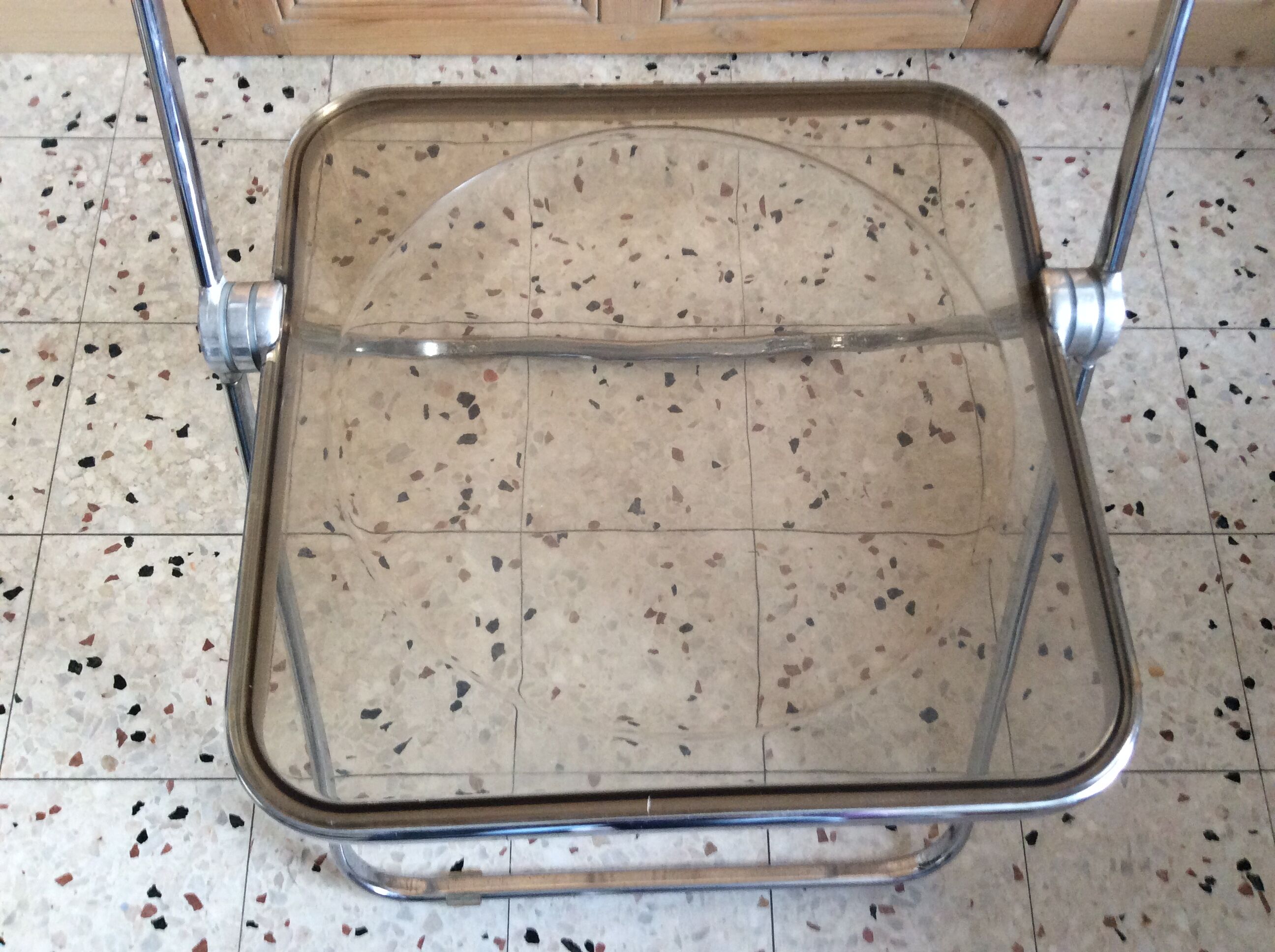 Folded chair by Giancardo Piretti for Castelli