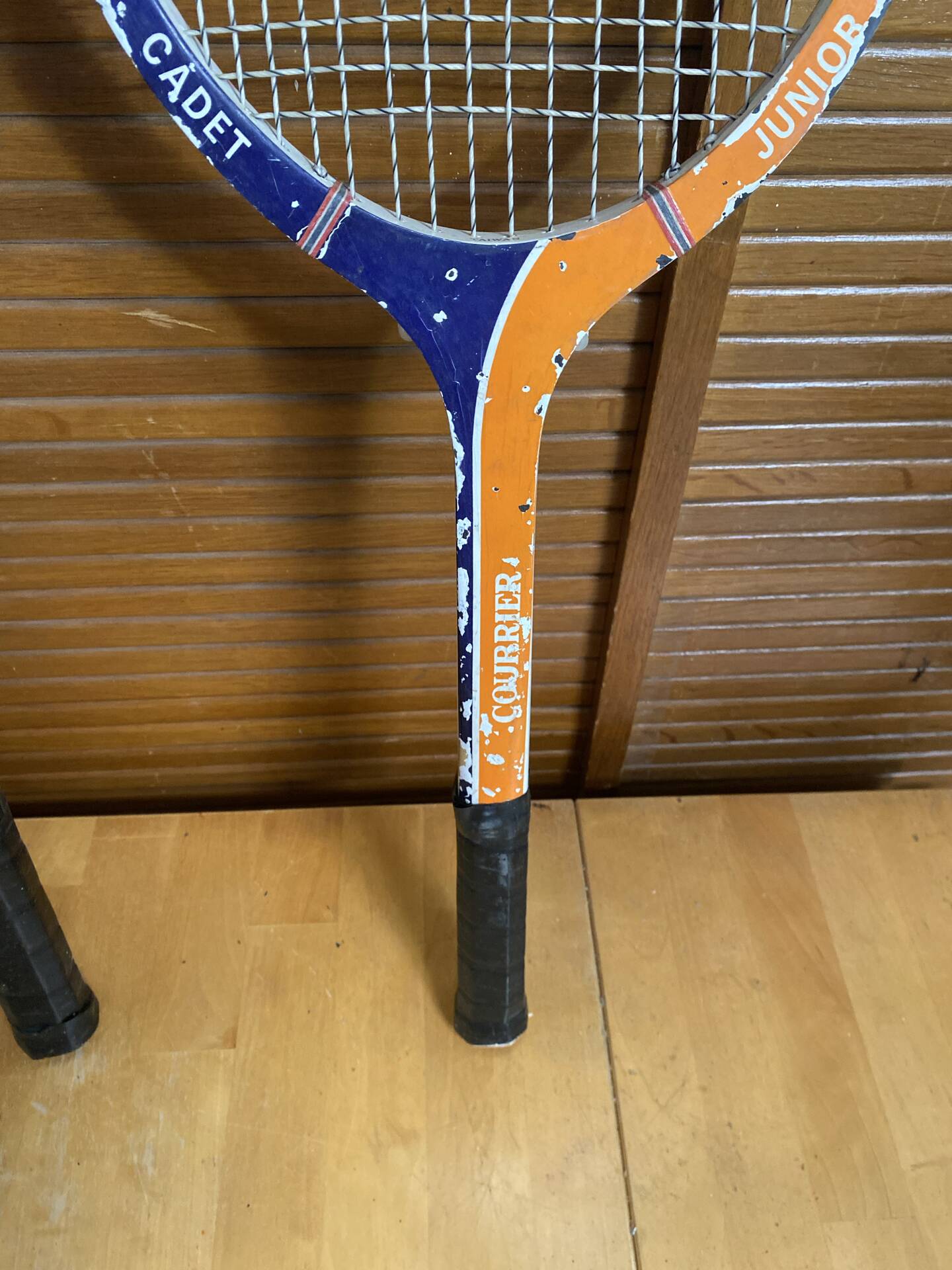Pair of vintage wooden tennis rackets for cadet junior sport courier
