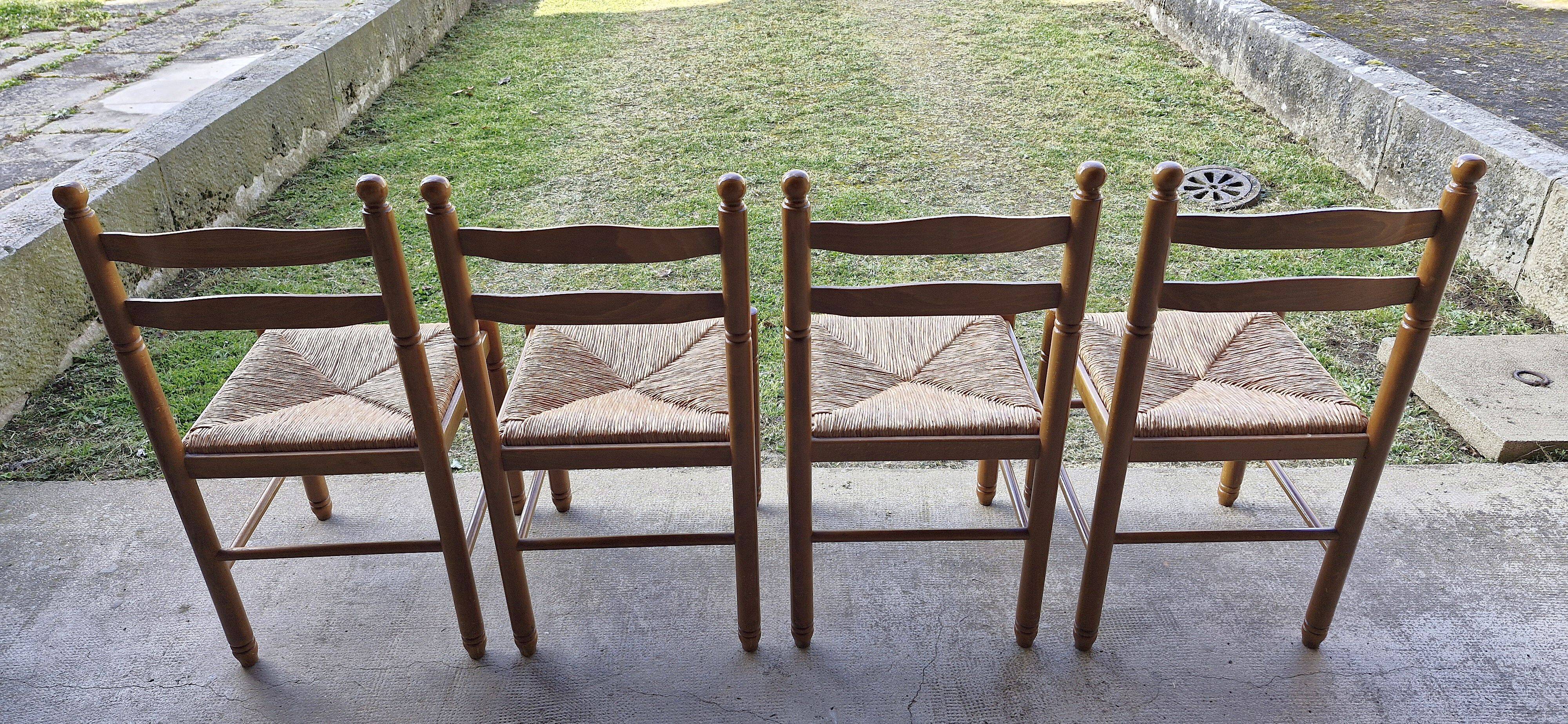 Wooden table with 2 extensions + 4 wooden chairs with rush seats
