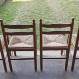 Wooden table with 2 extensions + 4 wooden chairs with rush seats
