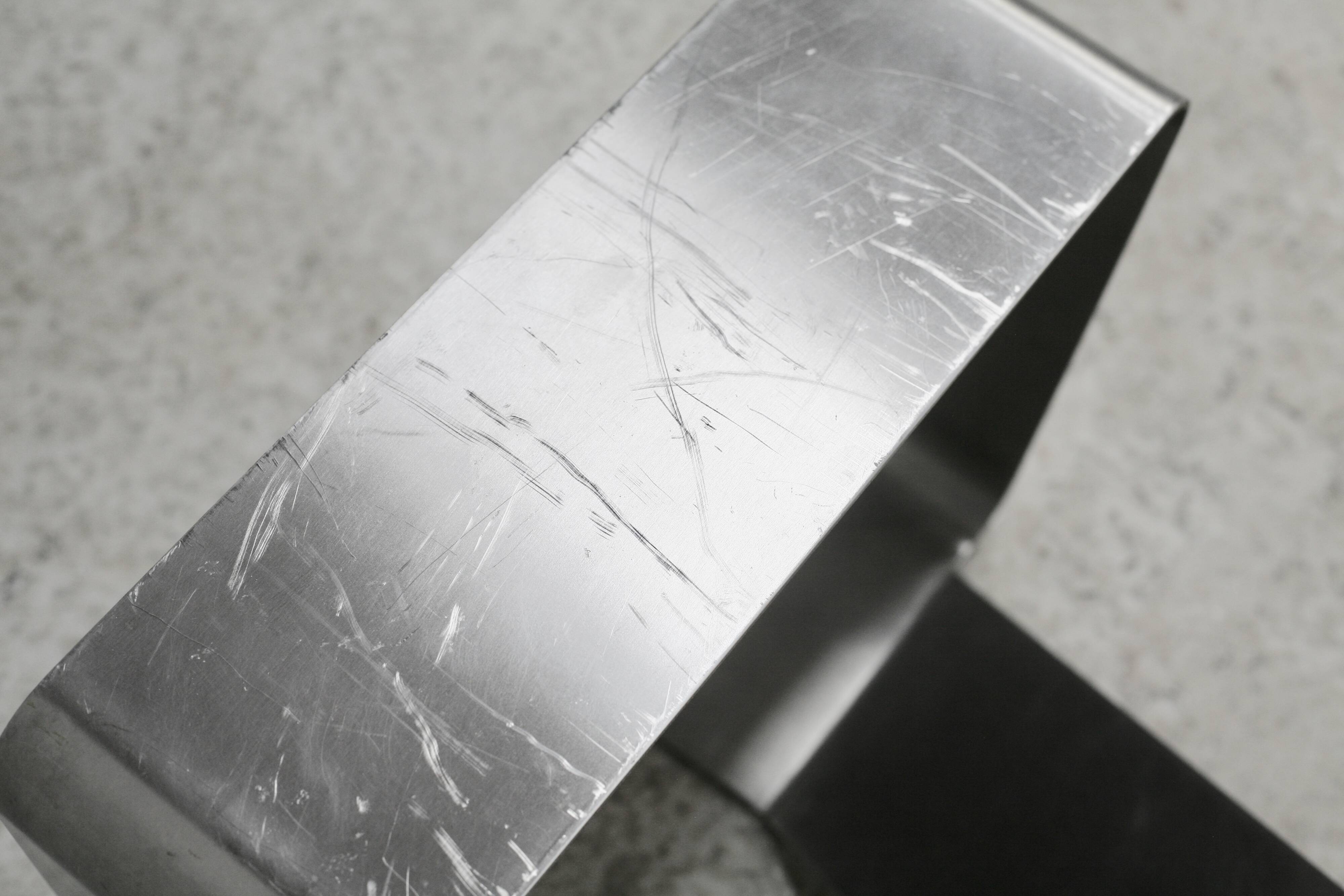 Coffee table with "kinetic" steel base and glass slab. Circa 1970.