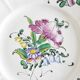Eastern earthenware plate with flowers