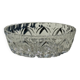 Circular glass ashtray with stylized petal patterns