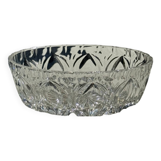 Circular glass ashtray with stylized petal patterns