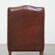 Vintage sheepskin leather armchair finished with black piping