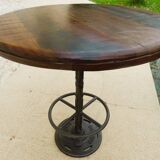 Unique bistro table with its adjustable industrial cast iron leg