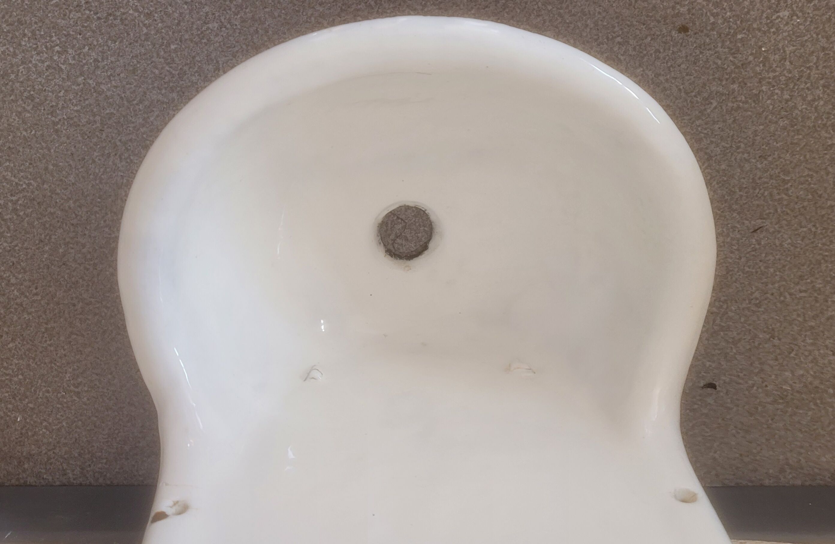 Old wall fountain washbasin