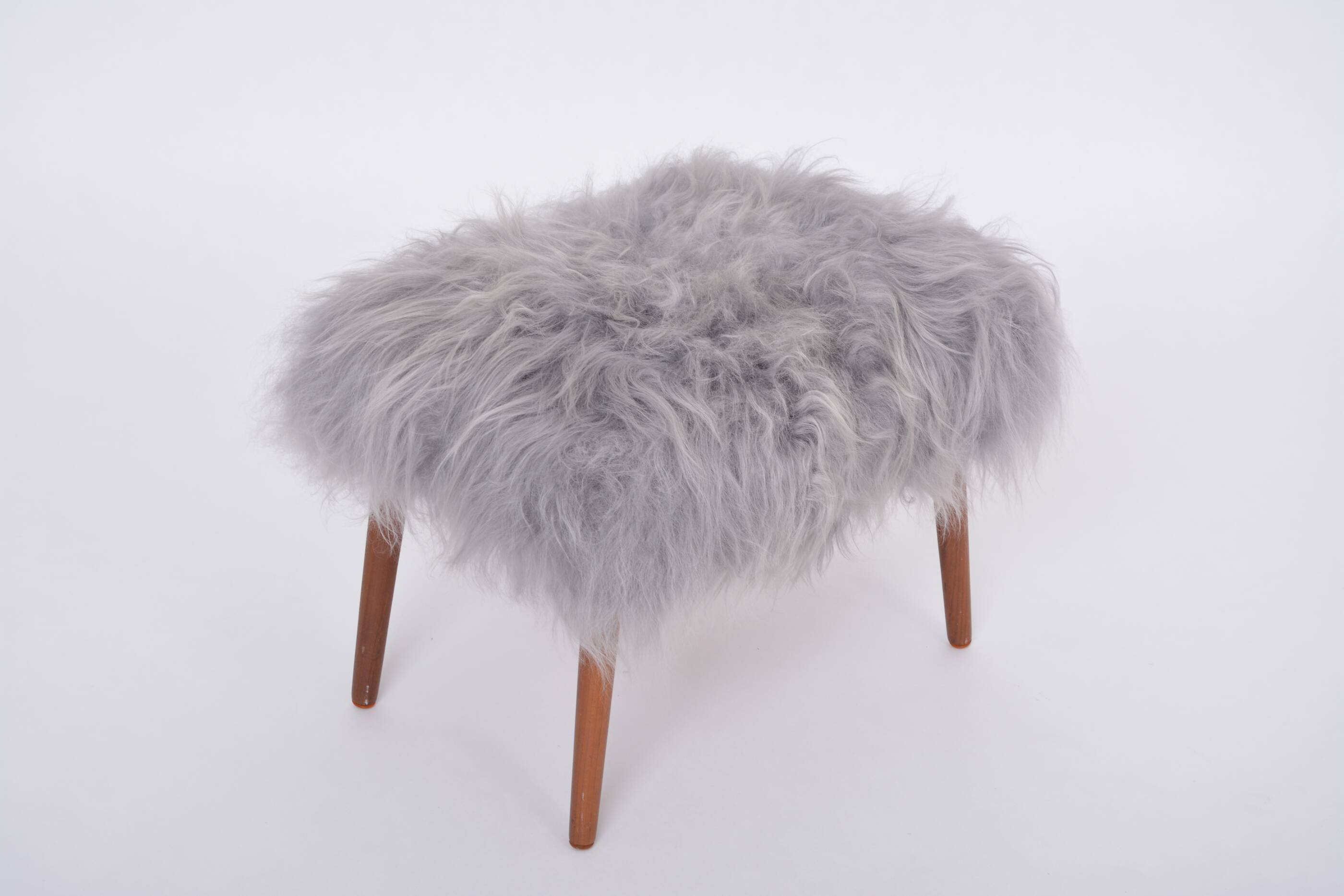 Danish Mid-century Modern stool reupholstered in grey sheep skin