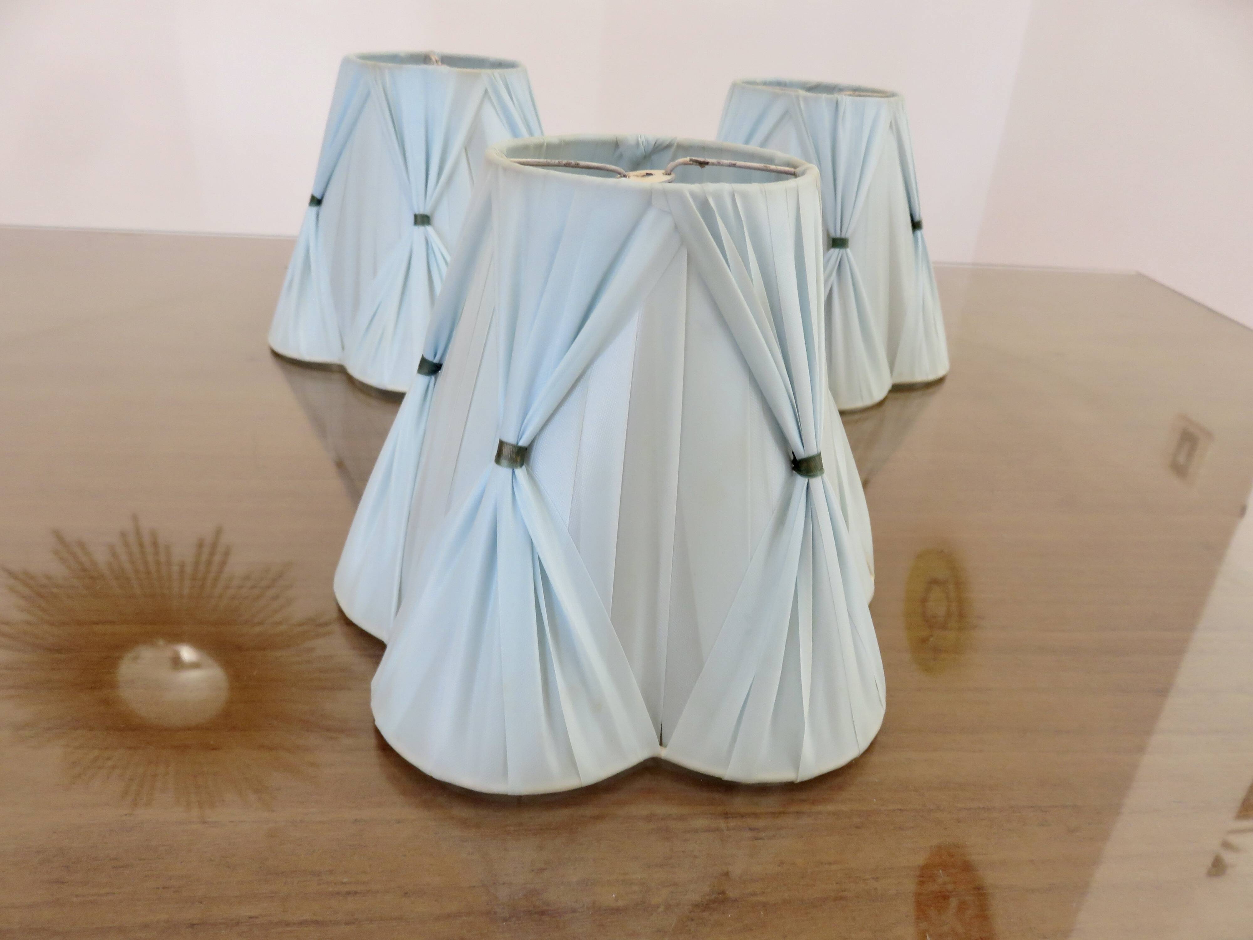 Set of 3 pale blue plastic strip lampshades, to clip onto a bulb.
