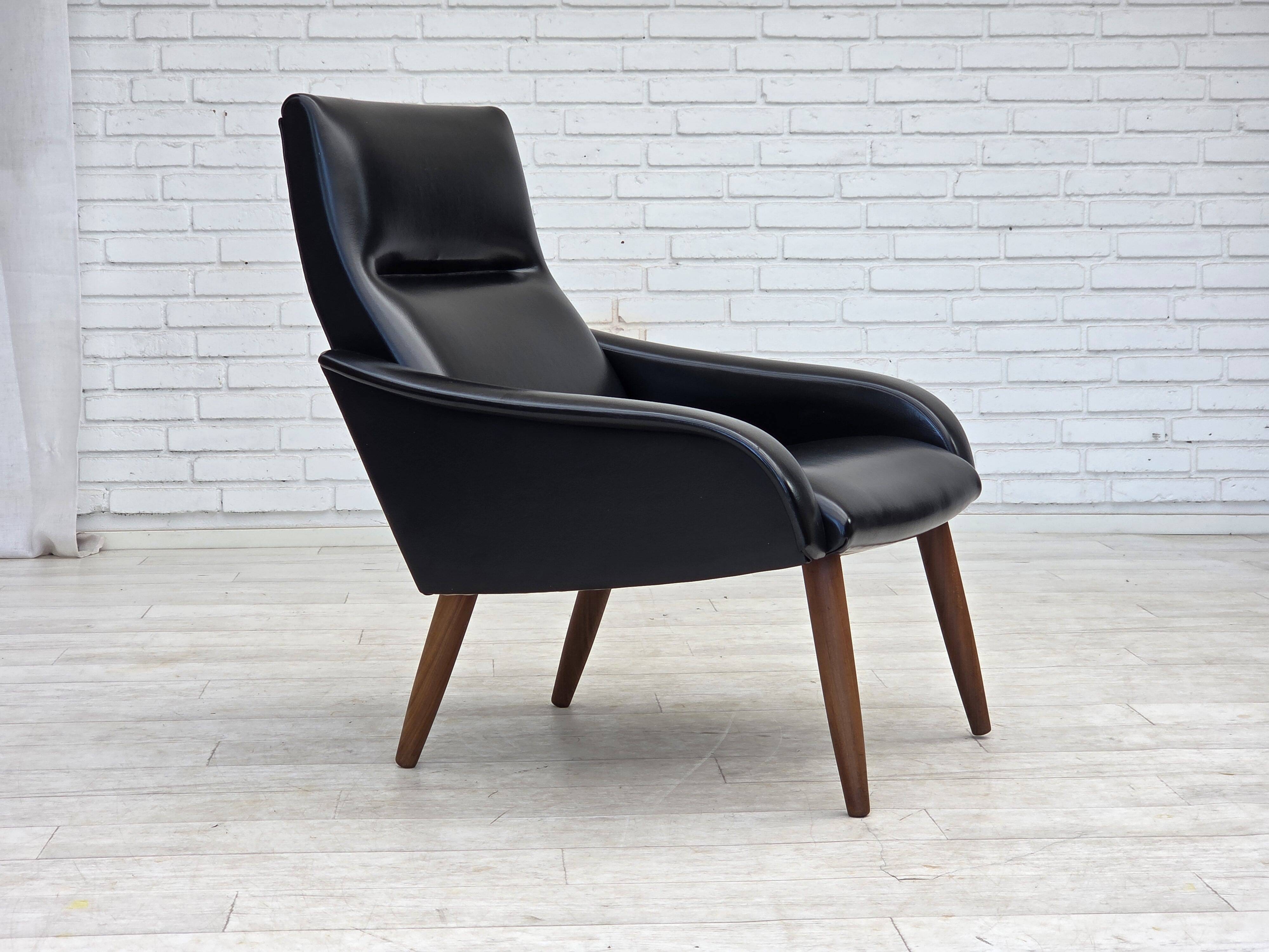 1970s, Danish armchair, black artificial leather, teak wood legs.