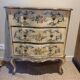 Serpentine commode, 18th century style, Italian, painted and gilded with patterns.
