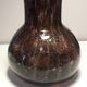 Plum-colored bubbled blown glass vase