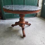 Round pedestal table with marble top and mahogany tripod from the 19th century