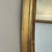 Oval mirror in carved wood