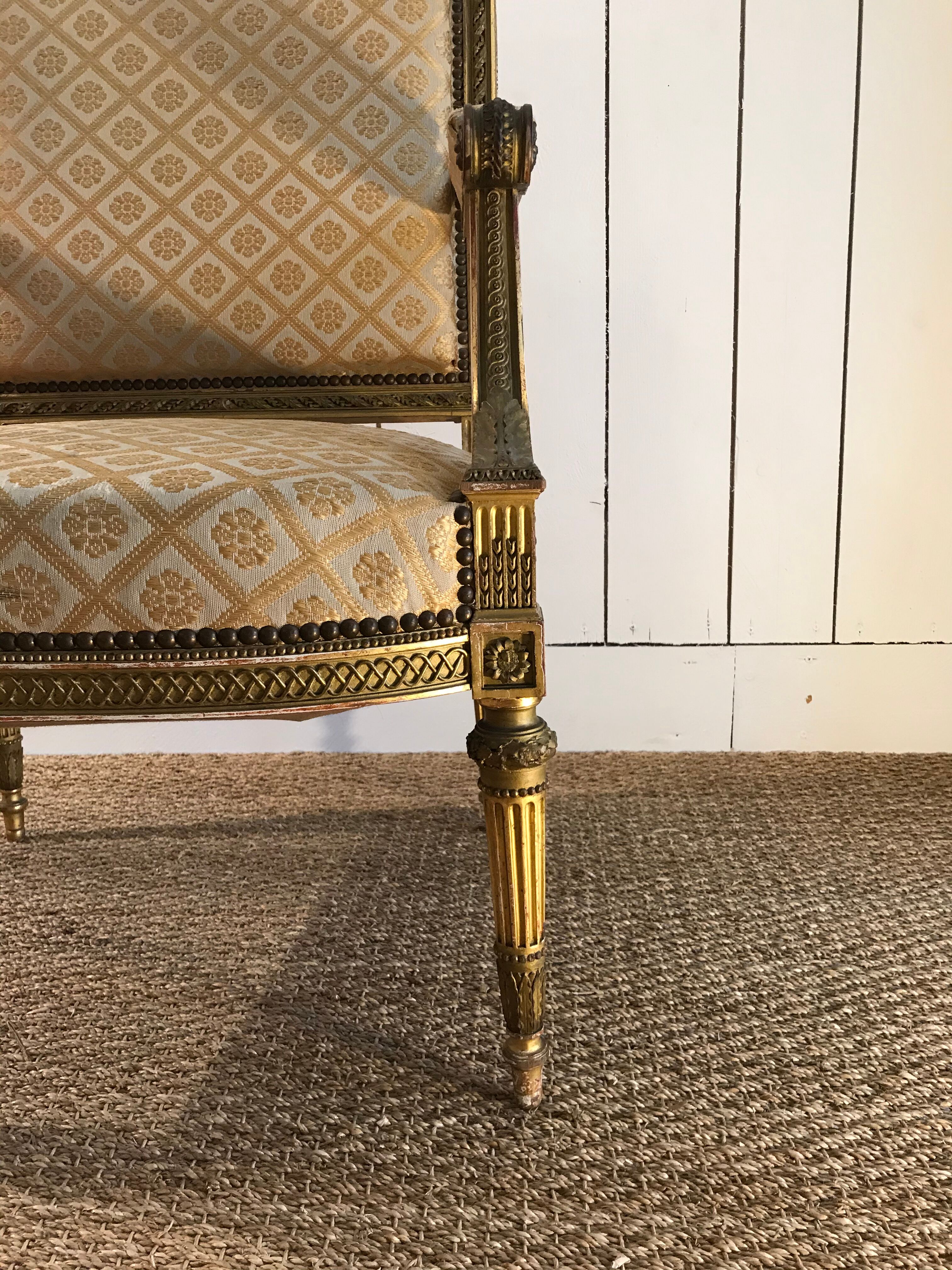 Louis XVI armchair in gilded wood carved and molded