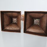 Set of a pair of candle holders and a hand candle holder