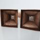 Set of a pair of candle holders and a hand candle holder