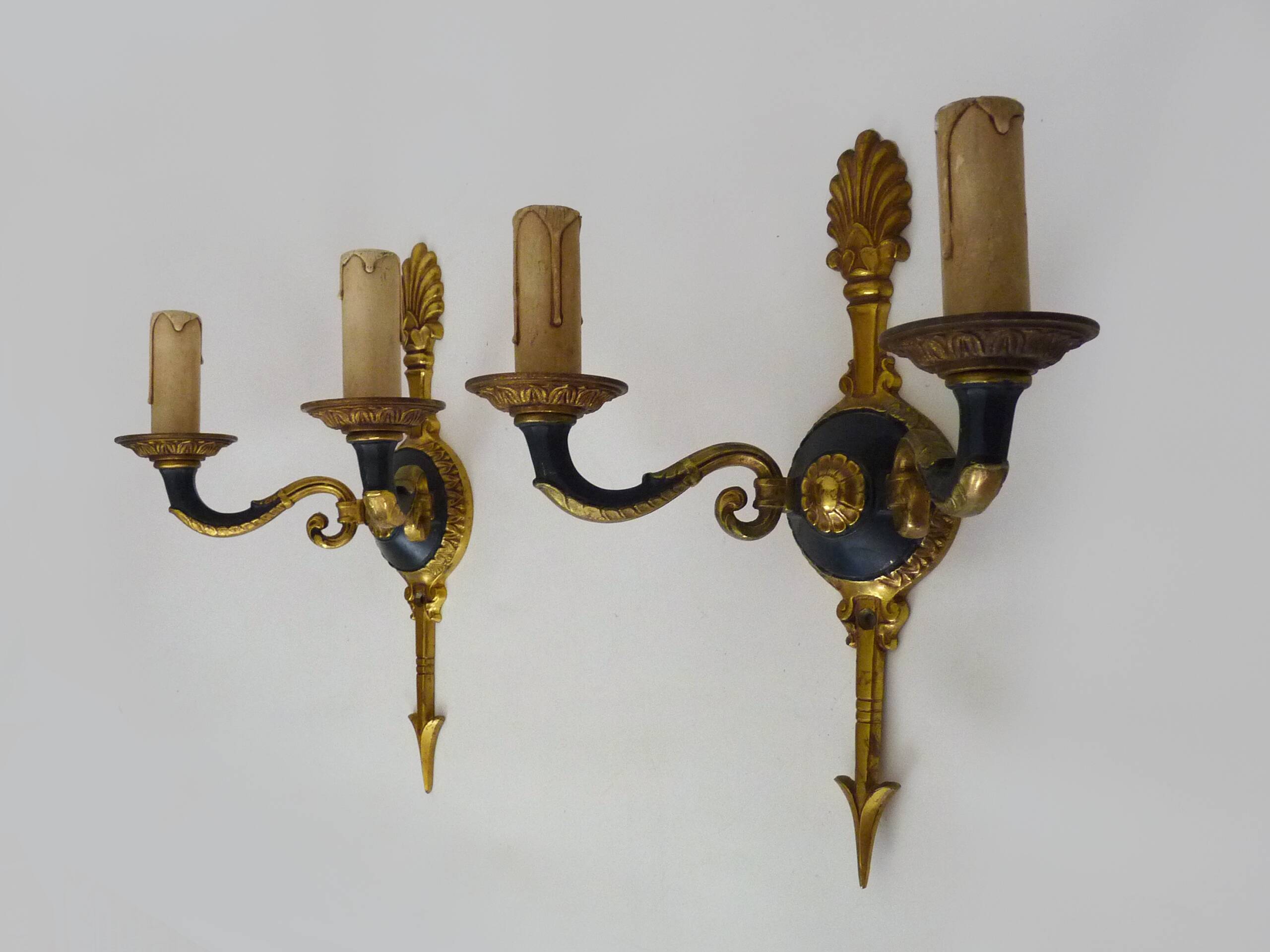 Pair of wall sconces in the Empire style with double lights in bronze.