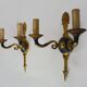 Pair of wall sconces in the Empire style with double lights in bronze.